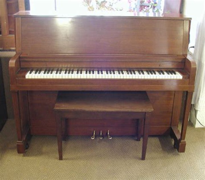 Can you lay a spinet piano on its back?