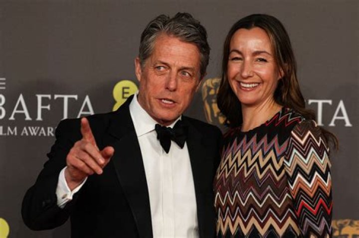 Has hugh grant got a brother?