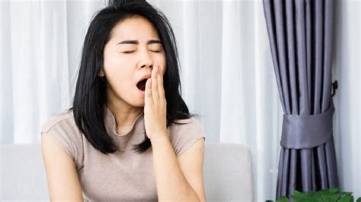 How are yawns caused?