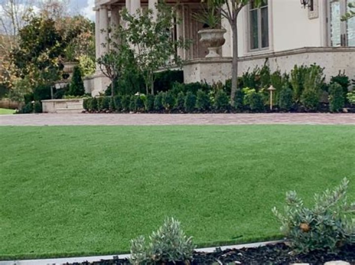 Is artificial grass cheaper than paving?