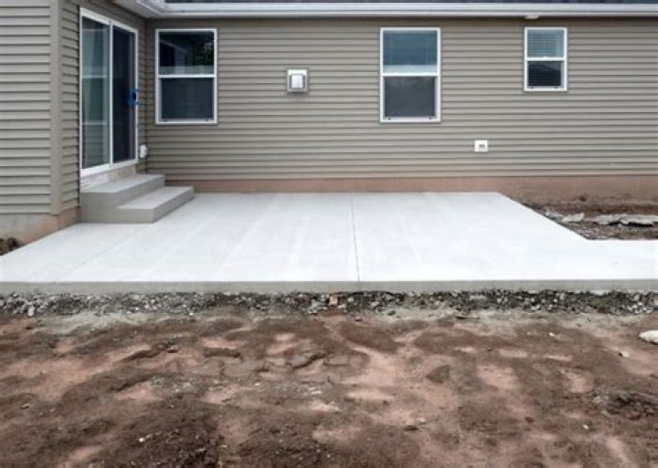 Is stamped concrete cheaper than flagstone?