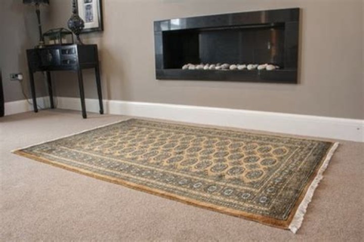 Should you layer rugs on carpet?
