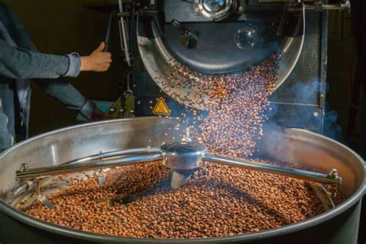 What does roasting coffee beans do?