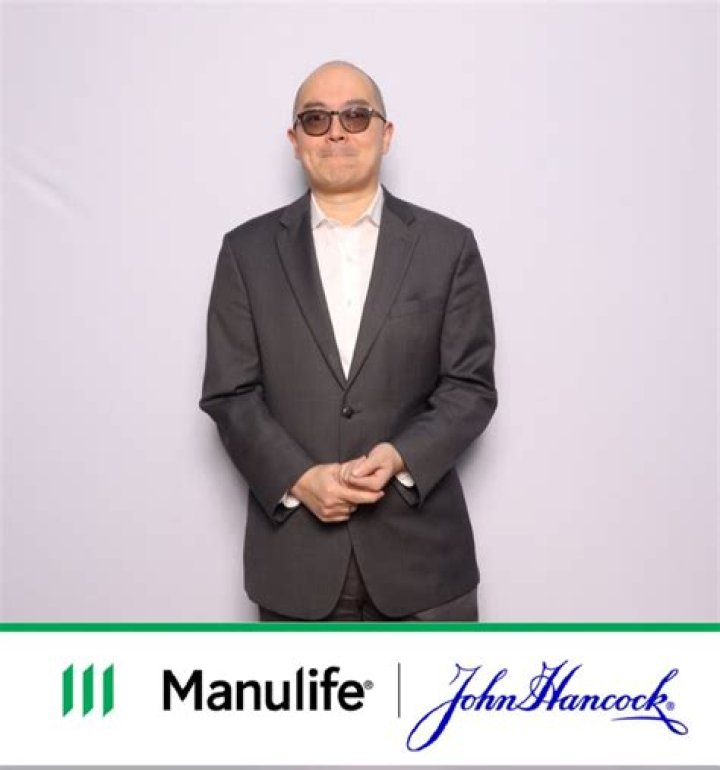 When did manulife buy john hancock?