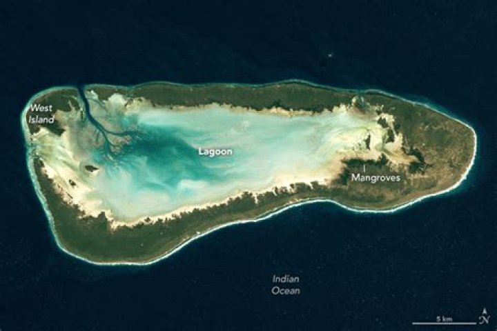 Where are atolls usually located around?