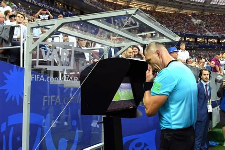 Where do var officials sit?