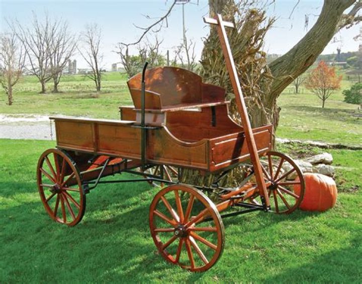 Who invented the buckboard wagon?