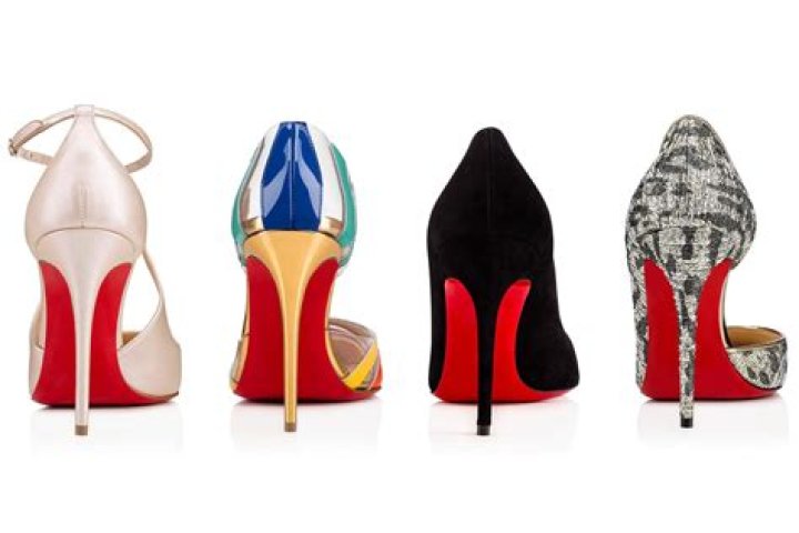 Whose shoes have red bottoms?
