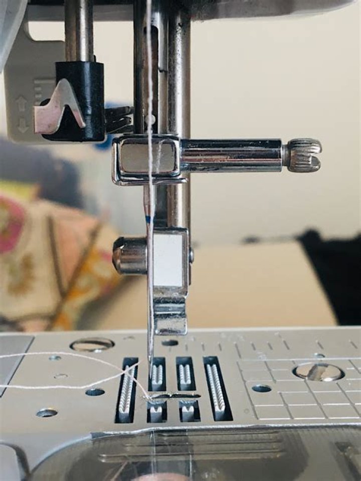 Why does my needle keep unthreading on my sewing machine?