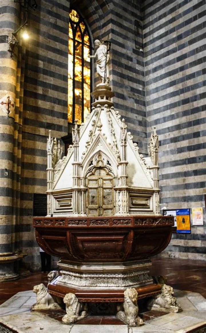 Why is the baptismal font at the front of the church?